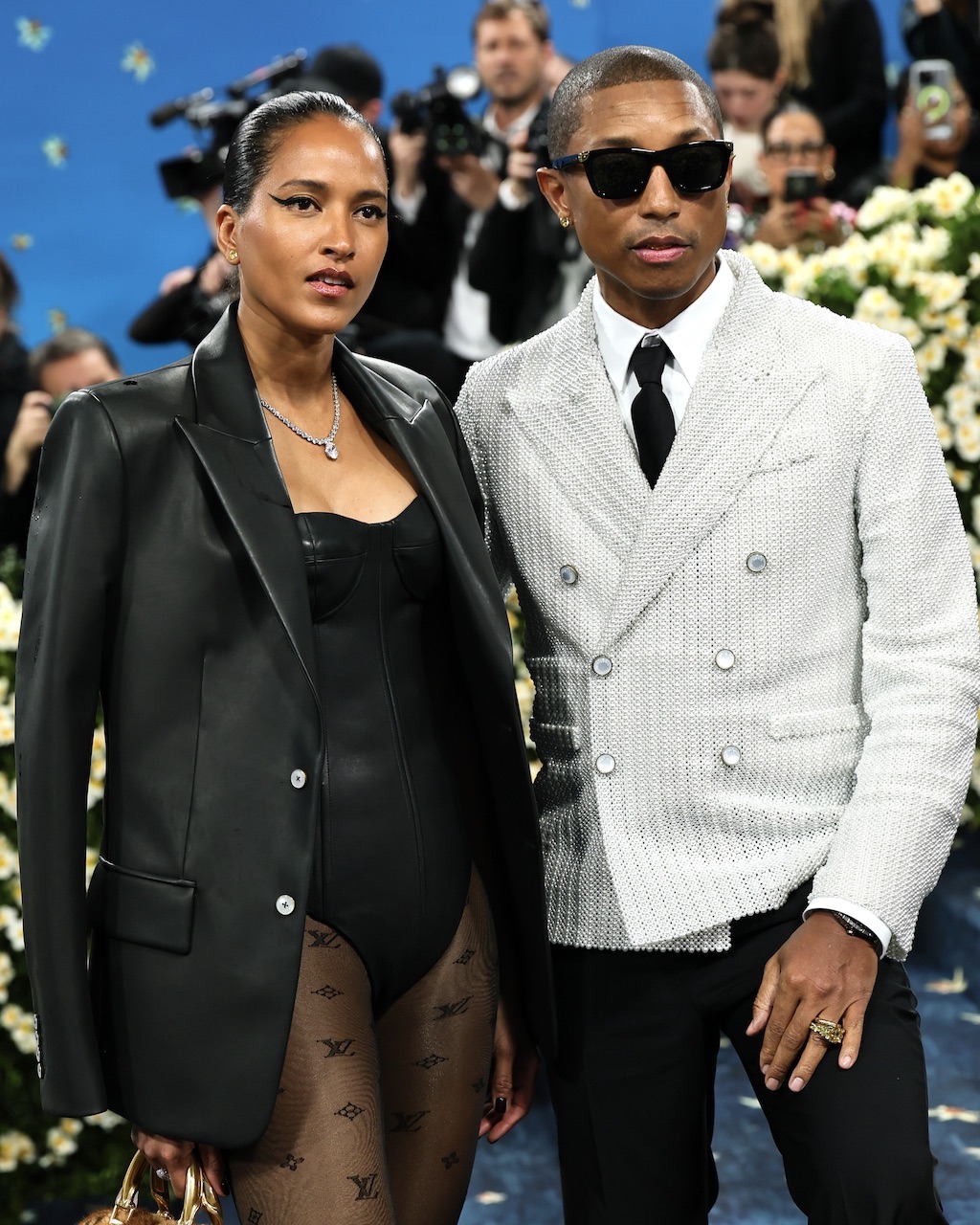 Pharrell Williams and Helen Lasichanh at the 2025 Met Gala, wearing Tiffany & Co. diamond jewelry