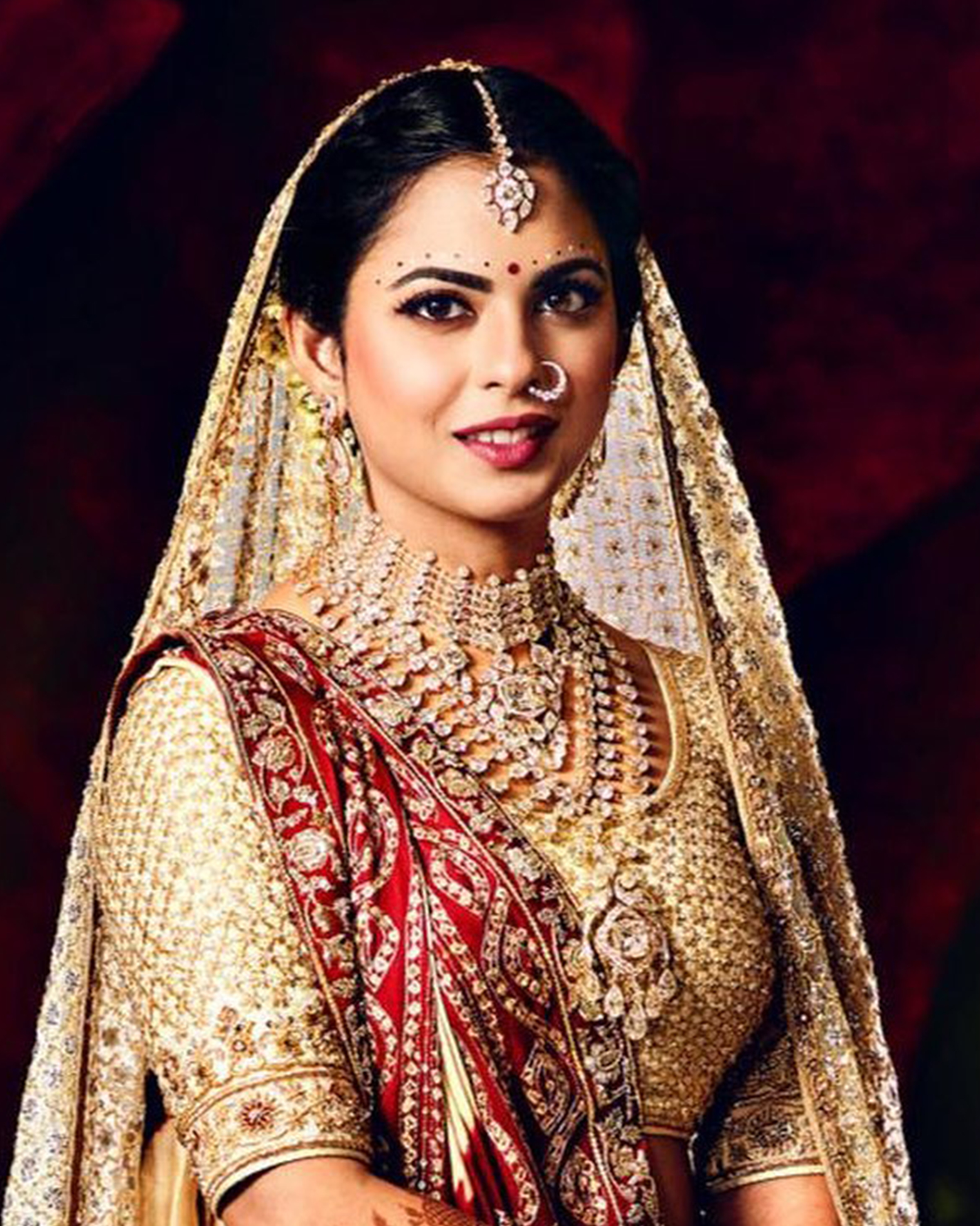 Isha Ambani in diamond choker with rani haars, maang tikka, earrings, and nath