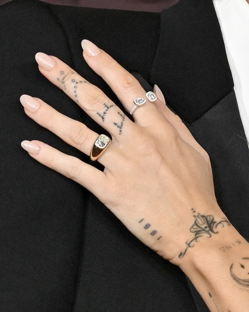 Miley Cyrus's Jacquie Aiche cushion-cut diamond engagement ring detail as seen at the premiere of "Avatar: Fire and Ash" on December 01, 2025 in Hollywood. (Getty Images)