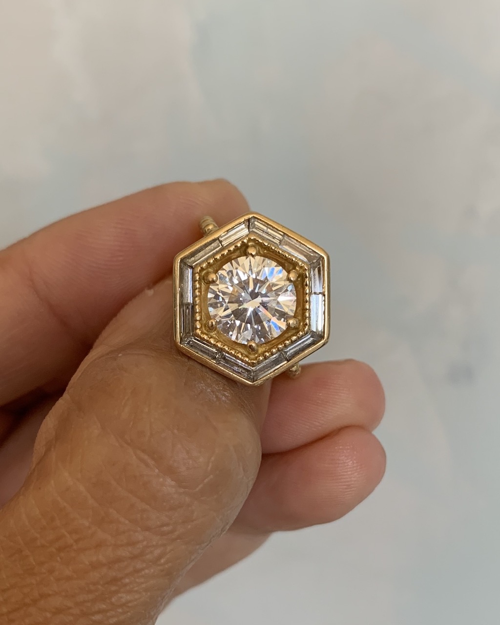 Lauren Harwell Godfrey Has Reimagined Her Sentimental Diamond Again, and Again 10 In the second reimagining of her diamond, Lauren Harwell Godfrey reset her round diamond in 18-karat yellow gold with a hexagonal halo of baguette-cut diamonds. ((Courtesy of the Designer)