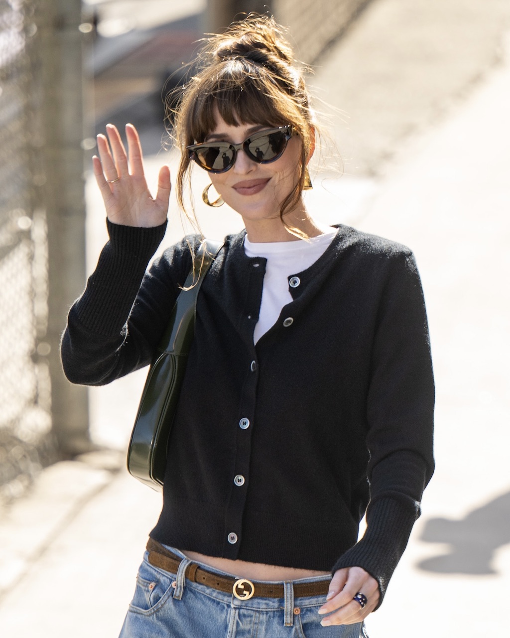 Dakota Johnson wore a Verdura "Night" Band Diamond Ring in a new street style moment 