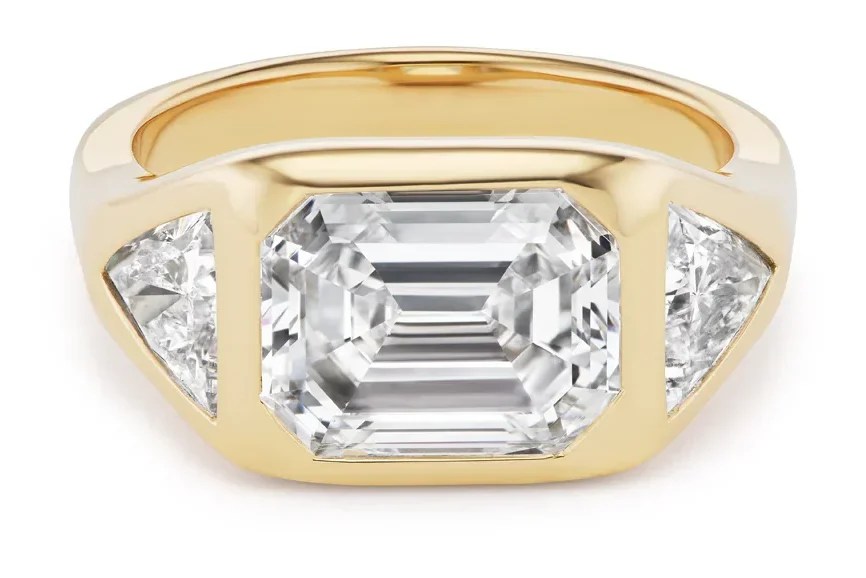 three stone ring with trillion cut diamond side stones