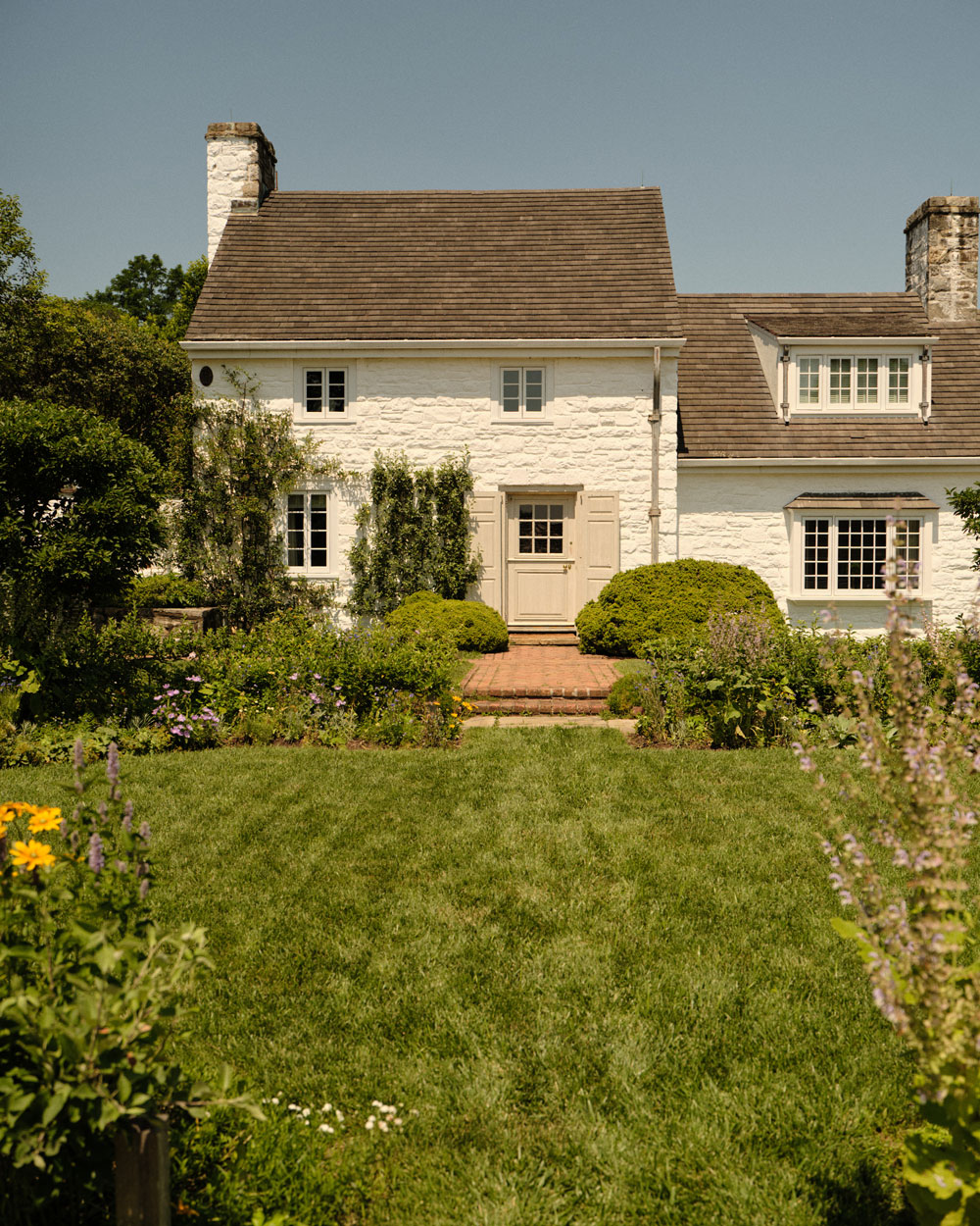 Bunny Mellon’s Extraordinary Legacy of Jewels 6 The exterior of Bunny Mellon’s beloved Oak Spring estate in Upperville, Virginia, where she spent countless hours gardening and cultivating the serene, understated beauty that defined her life’s aesthetic. (Photographed by Adrian Martin)