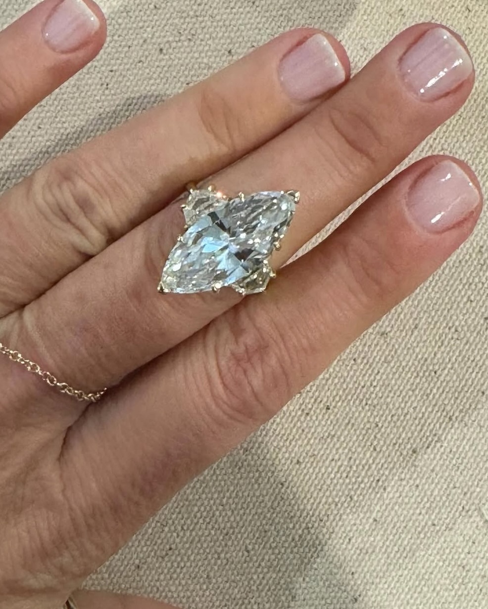 Jewelry designer Jacquie Aiche marked her divorce with an 8-carat marquise-cut diamond divorce ring, framed by two Cadillac-cut side stones.