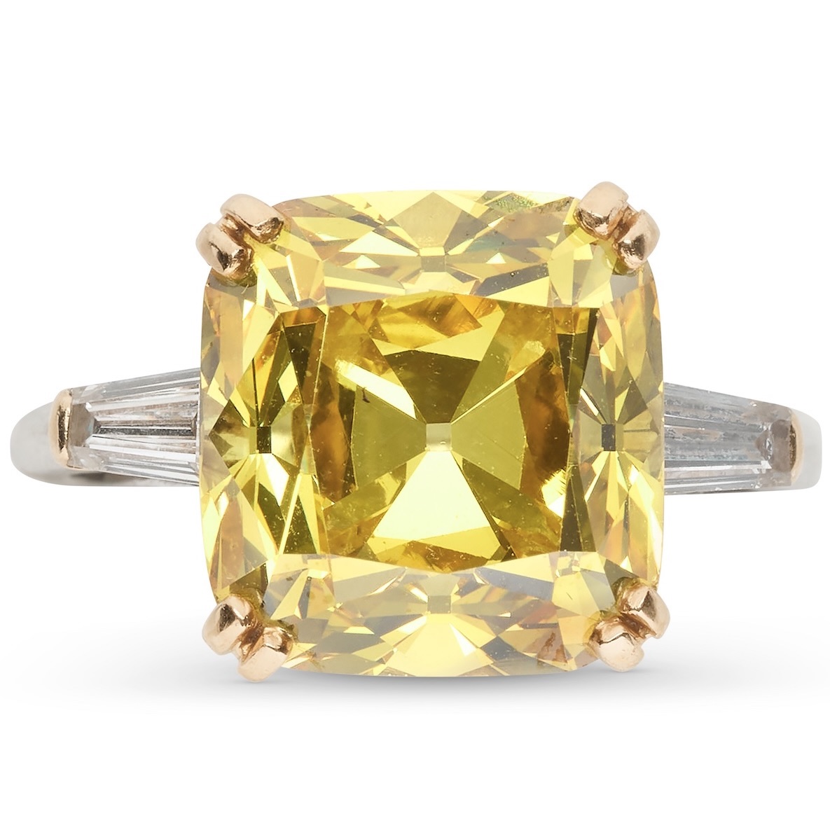 Claibourne Poindexter, Head of Christie’s Jewelry - A cushion brilliant-cut, 9.67-carat, fancy-vivid-orangey-yellow, VS1-clarity diamond ring with tapered-baguette diamonds.