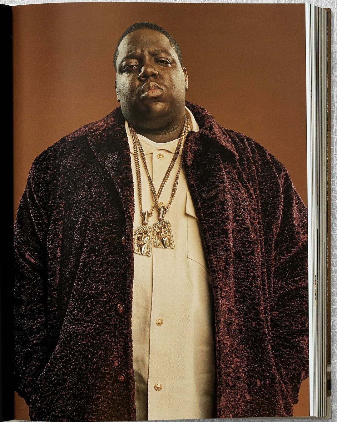 Biggie Smalls wears two of his Jesus Pieces by Tito Caicedo of Manny’s New York. Image featured in Ice Cold: The History of Hip-Hop Jewelry. (Courtesy of Taschen)