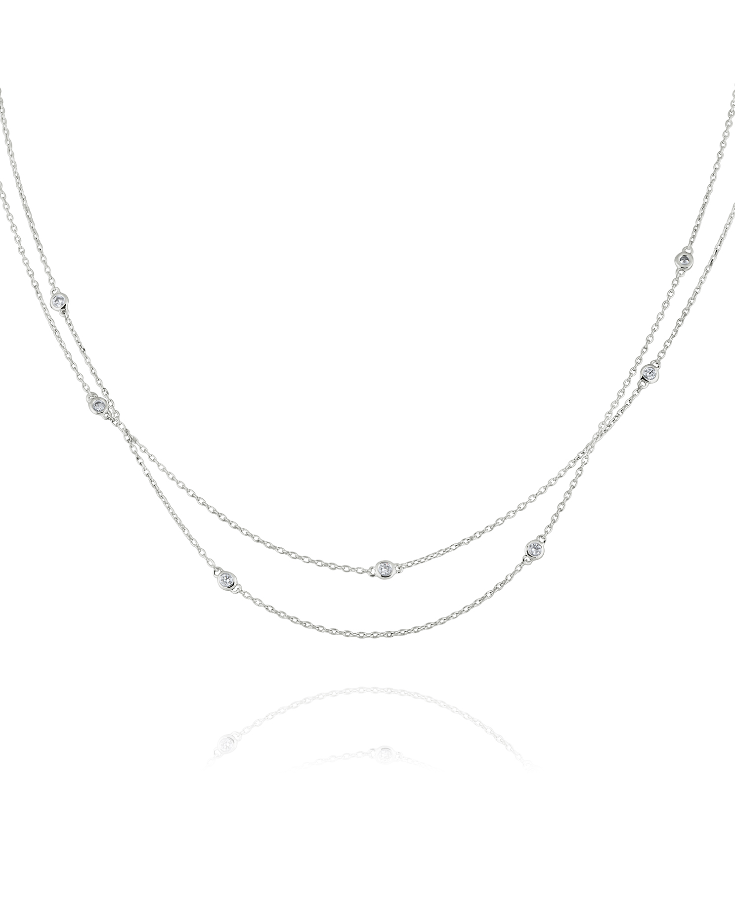 Three-layer diamond necklace with round pendants.