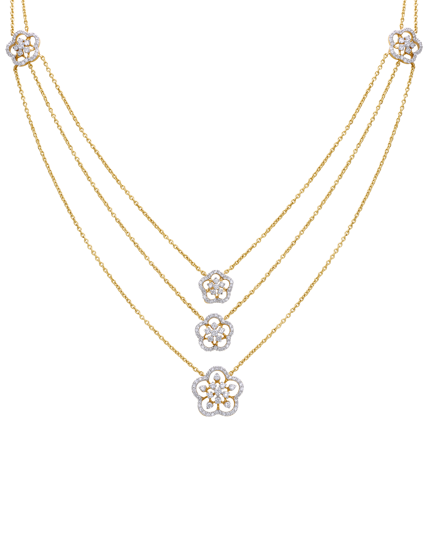 Three-layer diamond necklace with floral charms.