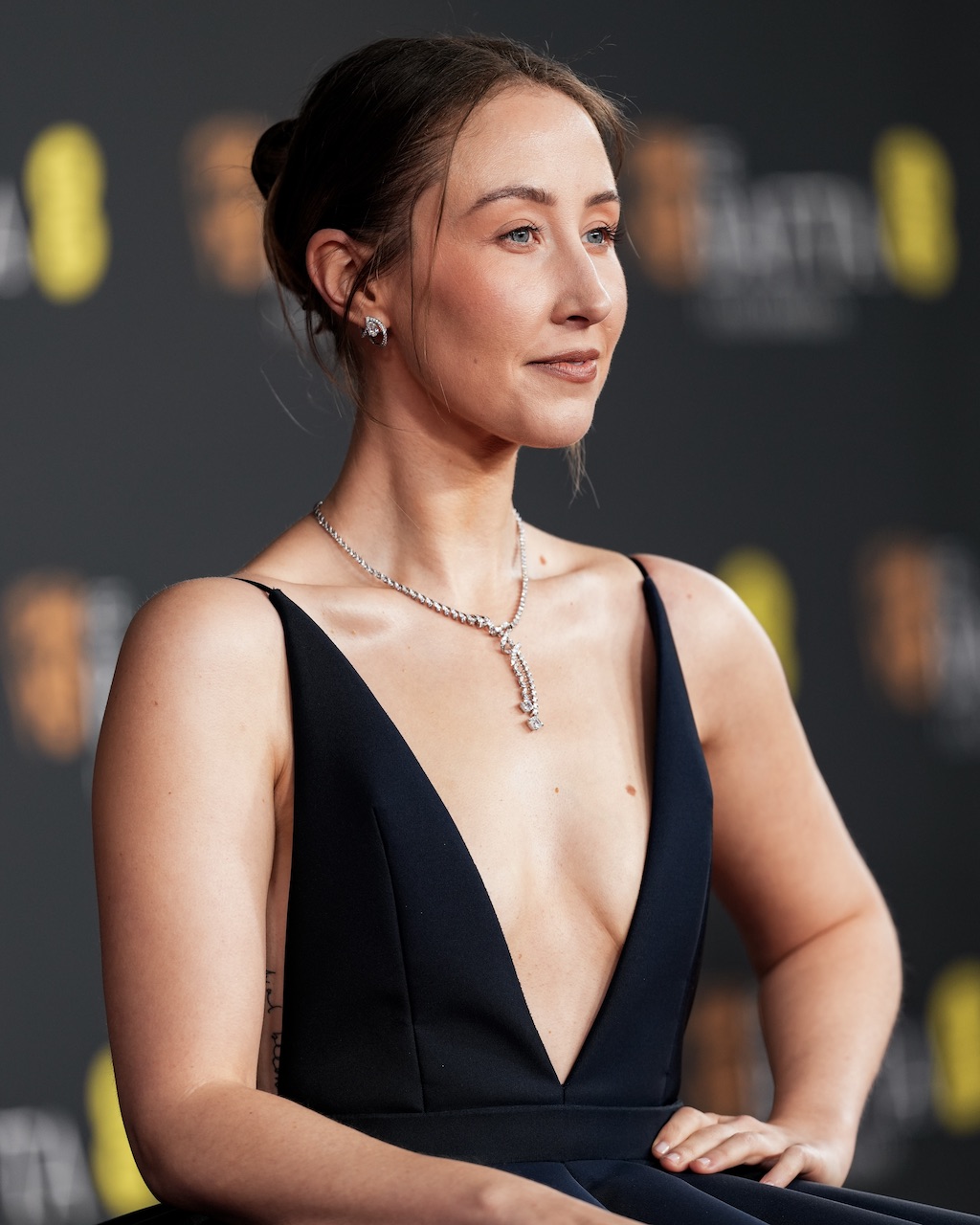Erin Doherty attends the BAFTA Awards 2026 in diamond jewelry