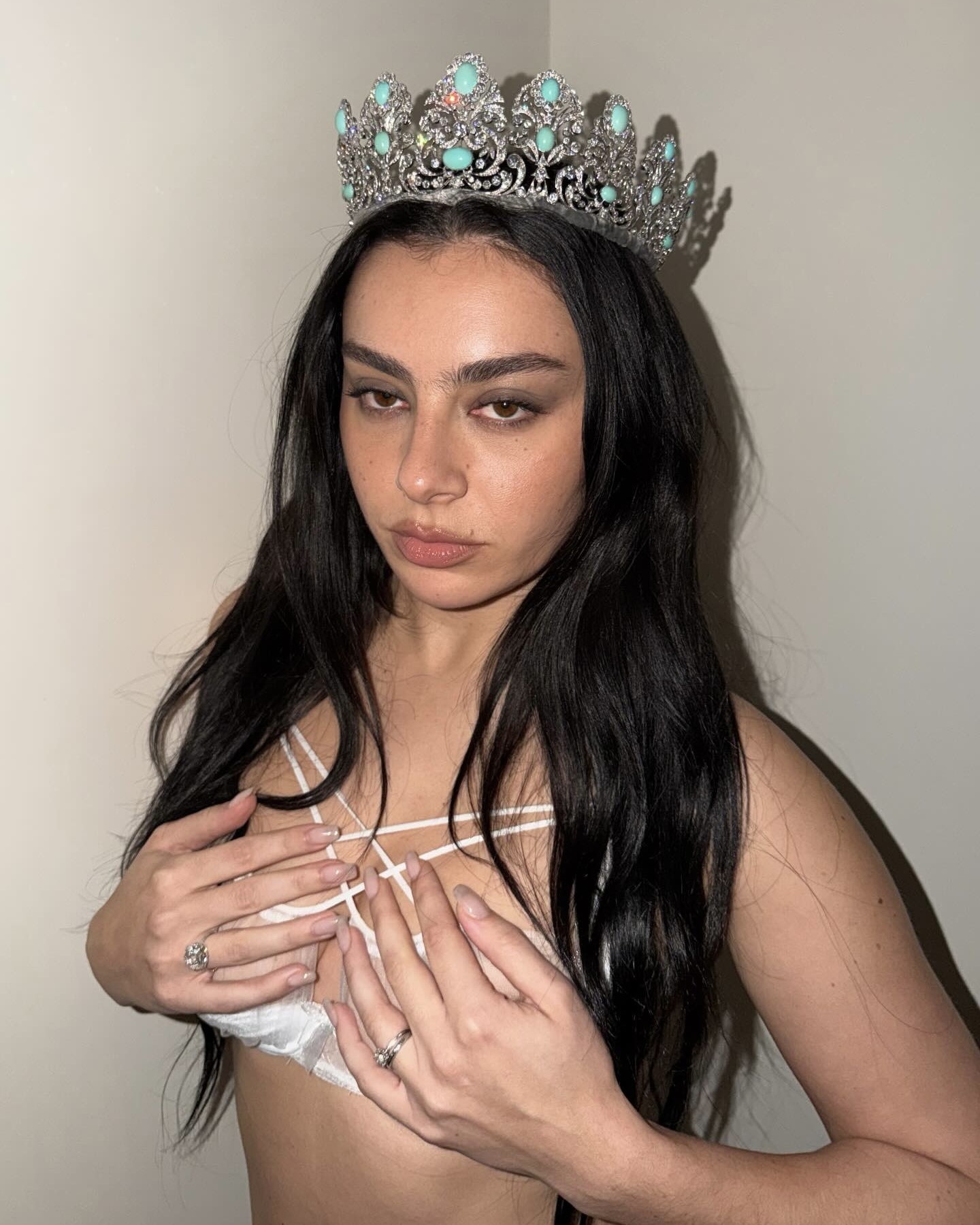 Charli XCX wore an antique Barron London diamond and turquoise tiara in an Instagram post on February 5, 2026. 