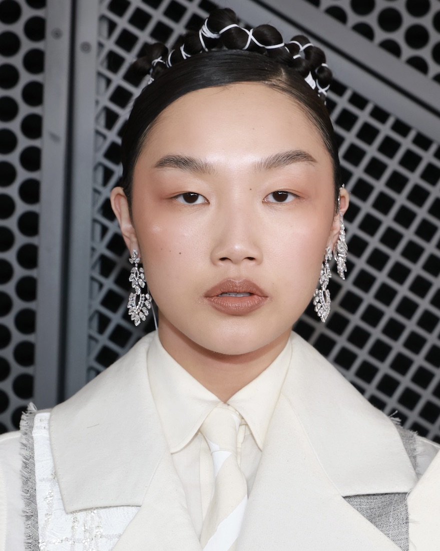 'KPop Demon Hunters' star Audrey Nuna wore diamond Messika chandelier earrings to walk the Grammys 2026 red carpet. 