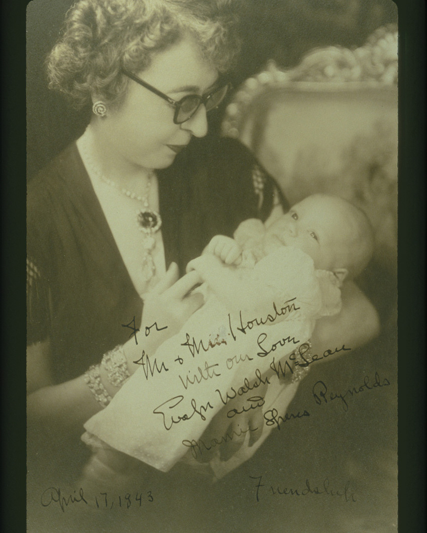 Evalyn Walsh McLean holding her grandchild in an inscribed family photograph, wearing both the Hope Diamond and the Star of the East Diamond (Wikimedia Commons/Public Domain)