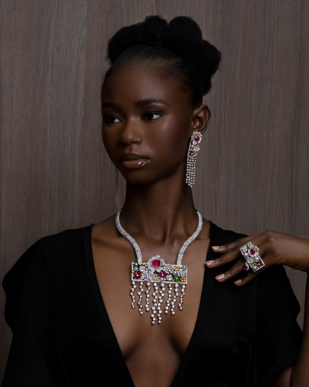 Paris Fashion Week: Akano Idenmili 18K gold necklace with yellow and white diamonds, pearls, rubellites, rubies, and tsavorites on model.