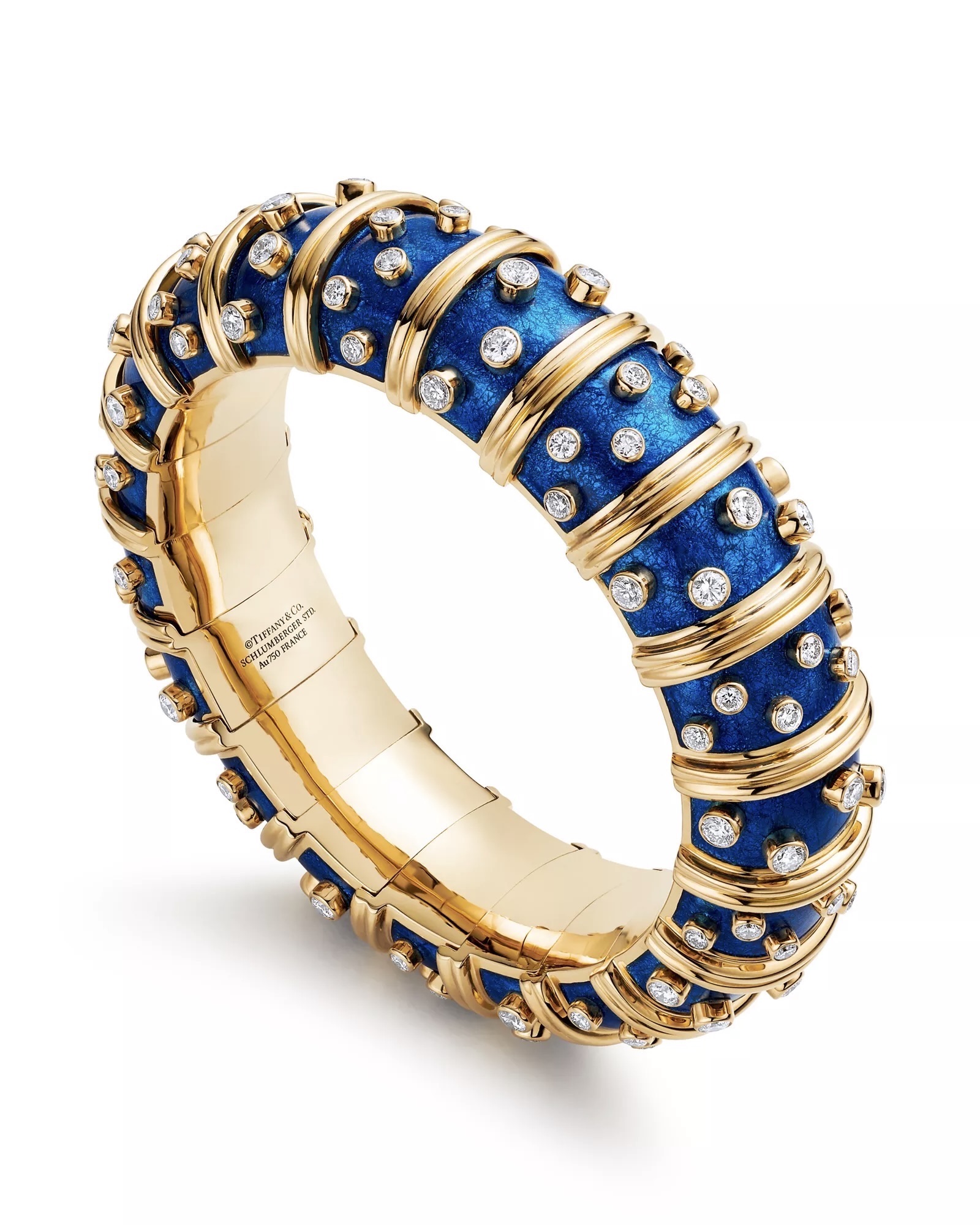 Jackie Kennedy wears Jean Schlumberger enamel Crosillon bracelets