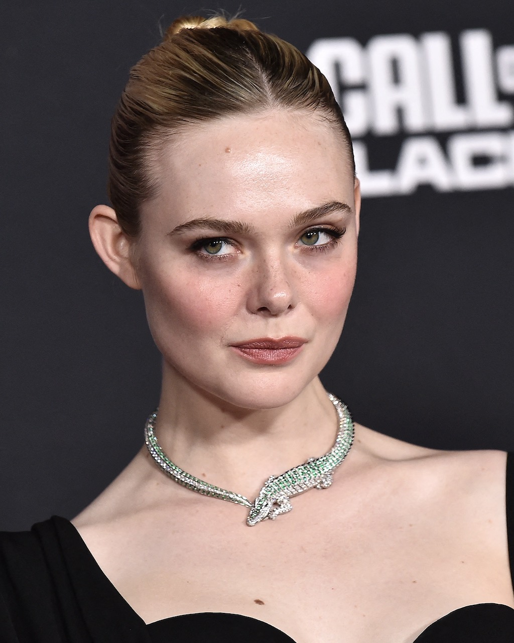 Elle Fanning Wears the Cartier Crocodile Necklace to the Predator: Badlands premiere in 2025