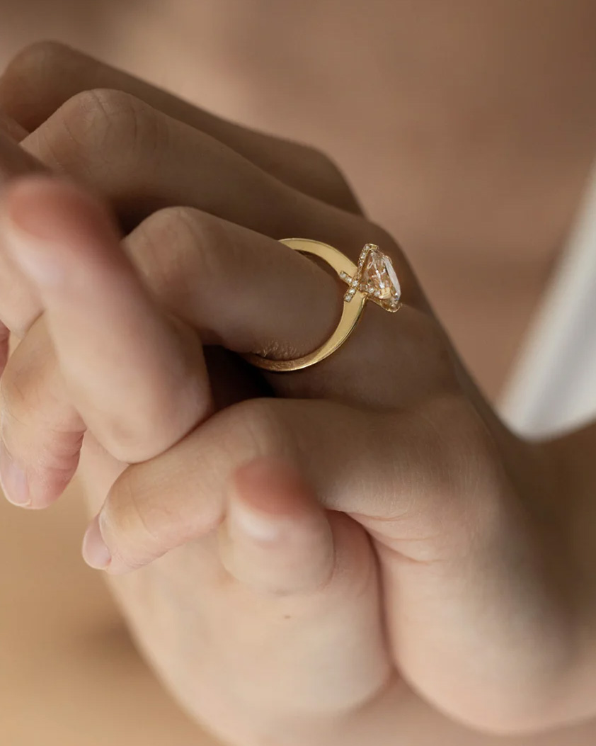 how to protect your engagement ring: diamond engagement ring on hand