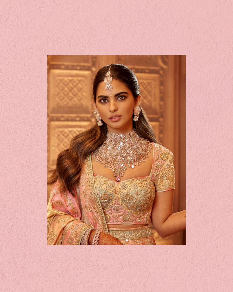 Isha Ambani wearing a diamond choker set with earrings and maang tikka.