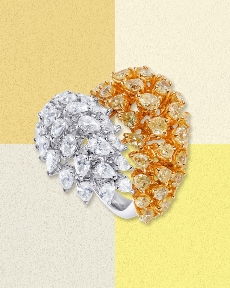 Ring with white and yellow diamonds in a split design.