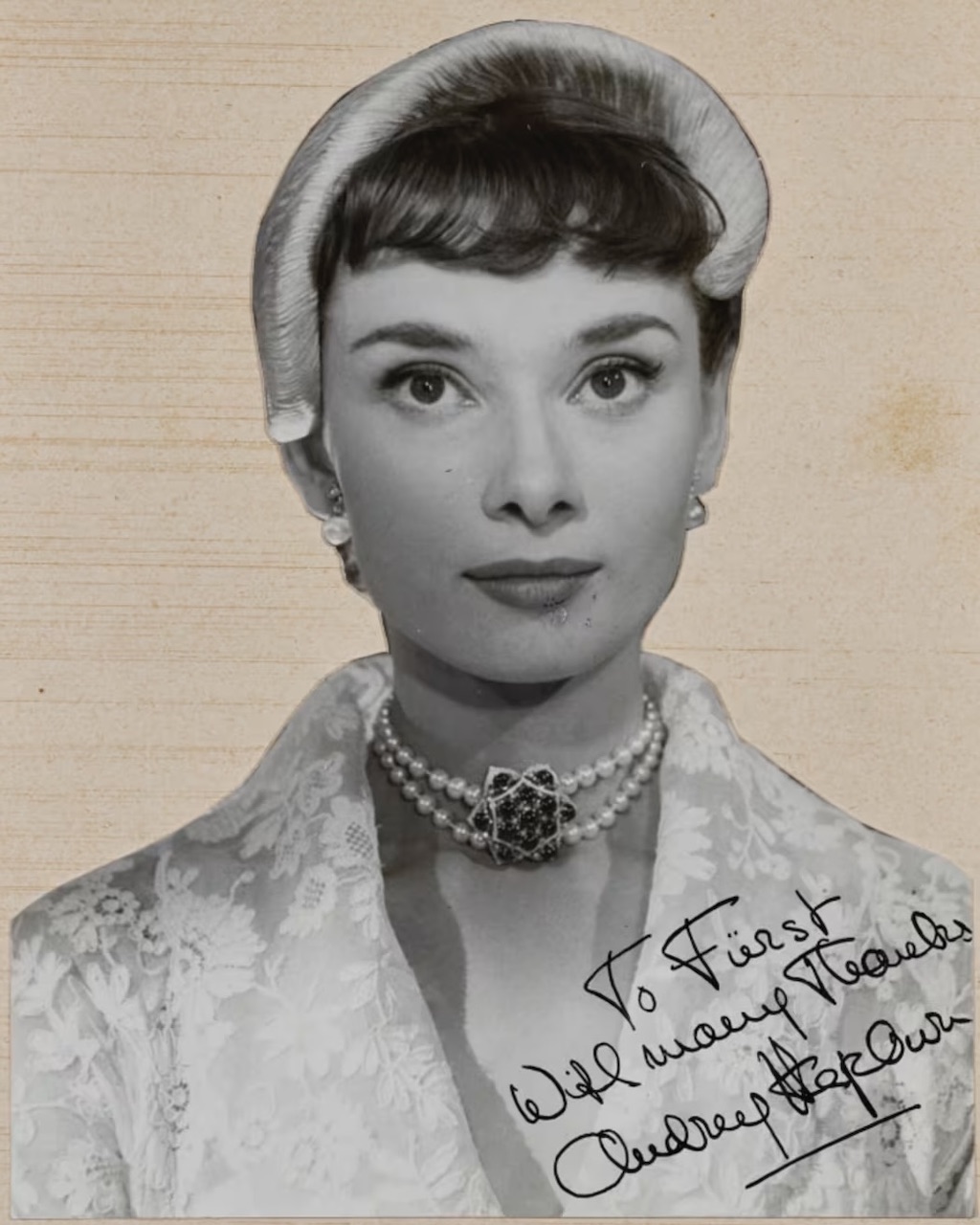 Audrey Hepburn wore a Fürst pearl, sapphire, and natural diamond choker in Roman Holiday. (Courtesy of Christie's)
