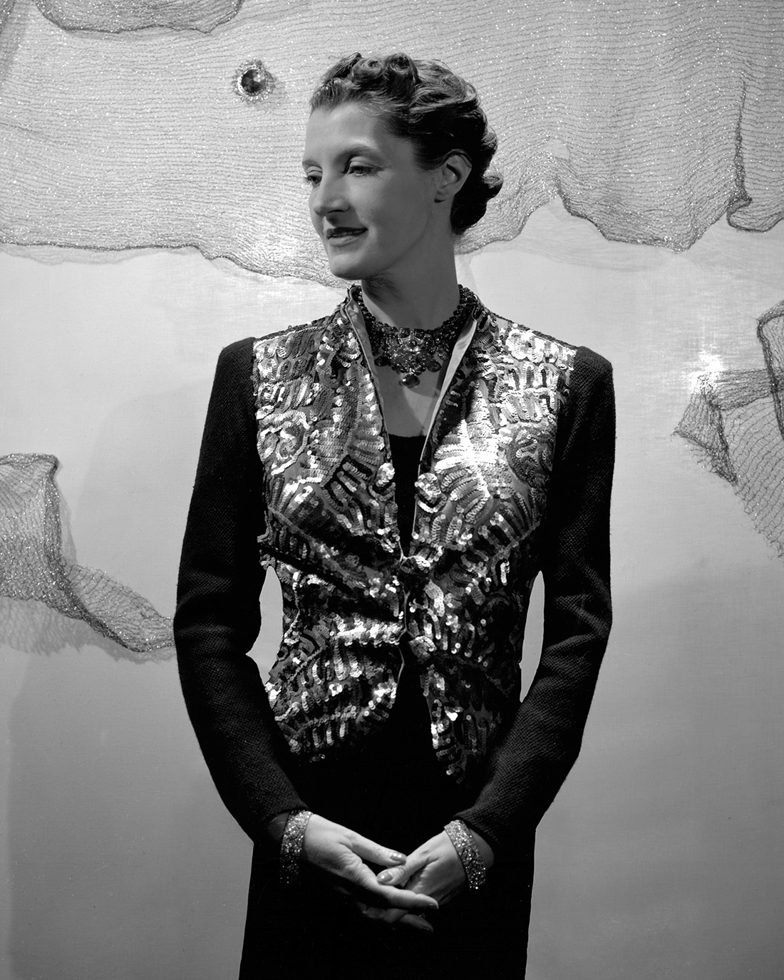 Portrait of author Daisy Fellowes wearing a custom Tutti Frutti Cartier necklace. (Photo by Cecil Beaton/Conde Nast via Getty Images)