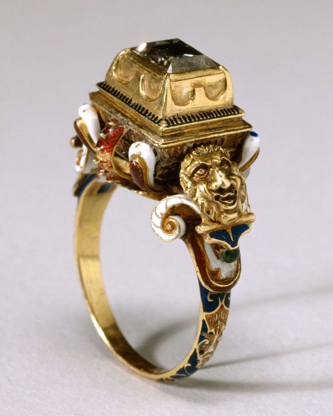 Table-cut diamond ring from the 16th century, featuring a raised box bezel supported by a structure resembling an inverted pyramid. The ring is lavishly covered with multicolored enameling. (Wikimedia Commons/Public Domain)