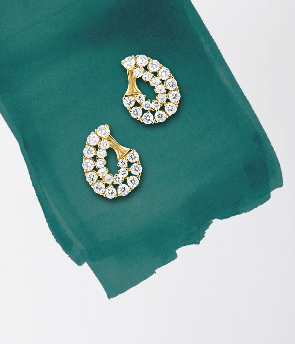 Pear shaped gold diamond stud earrings