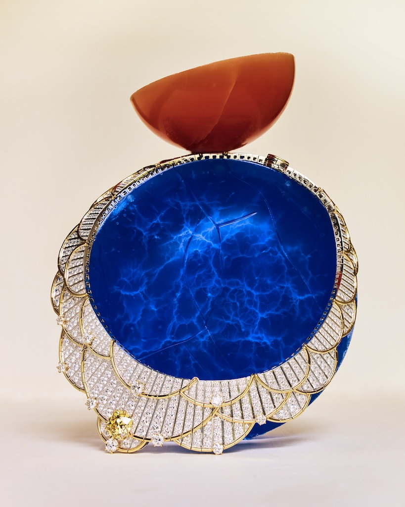 Egyptomania Van Cleef & Arpels “Beauté légendaire” necklace featuring a cushion-cut Fancy Vivid Yellow diamond of 10.02 carats, sapphires, and diamonds, set in white gold and yellow gold. (Photographed by Benjamin Bouchet for Only Natural Diamonds)