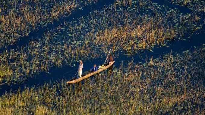 A mokoro canoe navigating the waterways of the Okavango Delta in Botswana. (Courtesy of Botswanamark)
